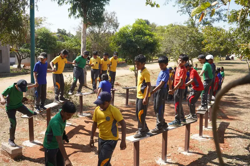 Mysuru ADDA field moment 7 — students mid-activity during an outdoor program